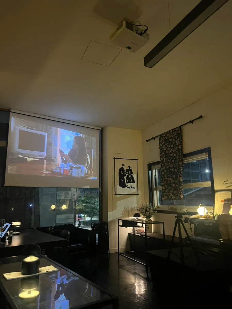 Calm café atmosphere with a movie playing