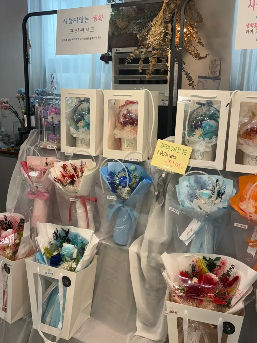 Various types of flower gift items on display