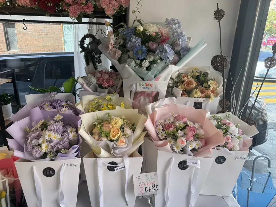 Front of the shop with a sign noting 24-hour, year-round operation
