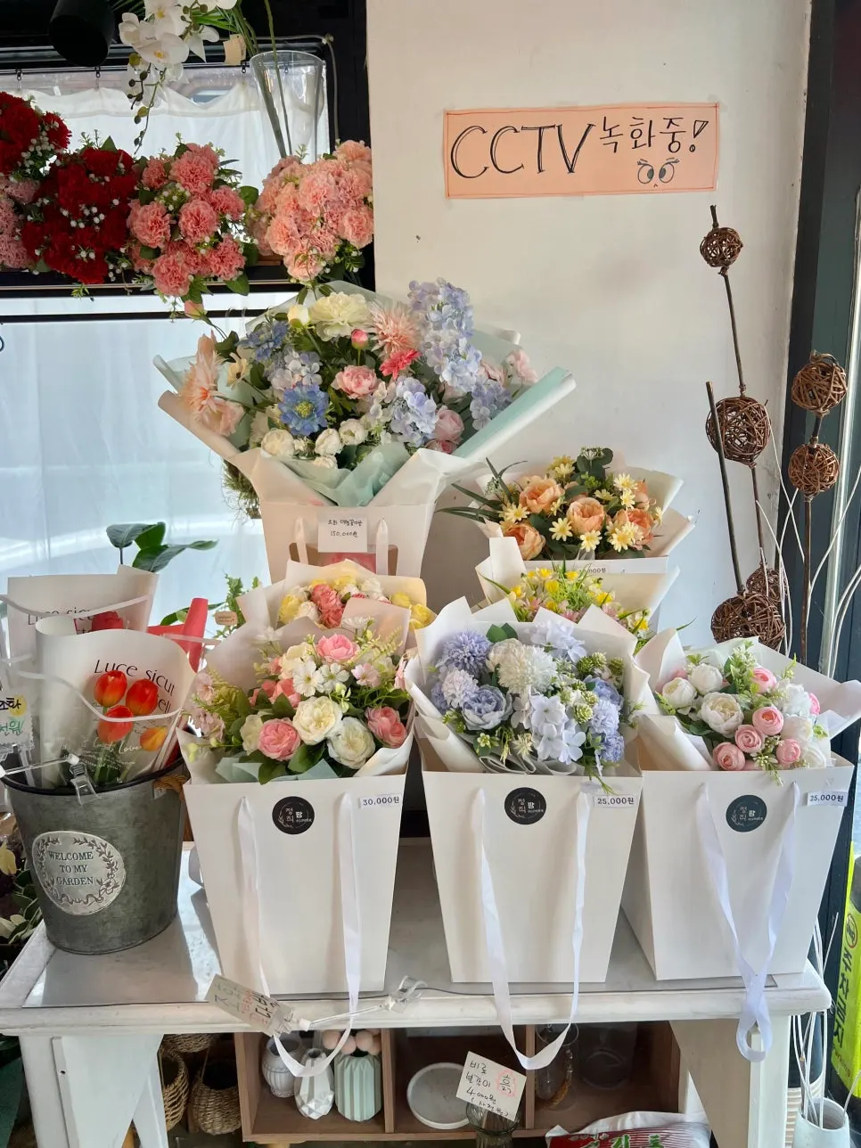 Entrance of the unmanned flower shop with a card tag control panel by the door