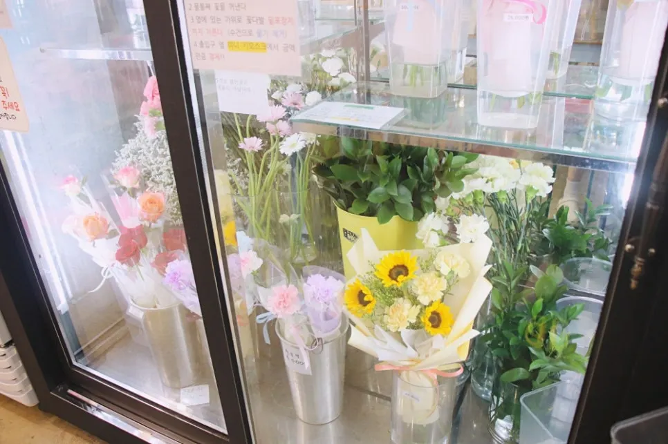 Flower fridge holding pre-ordered bouquets