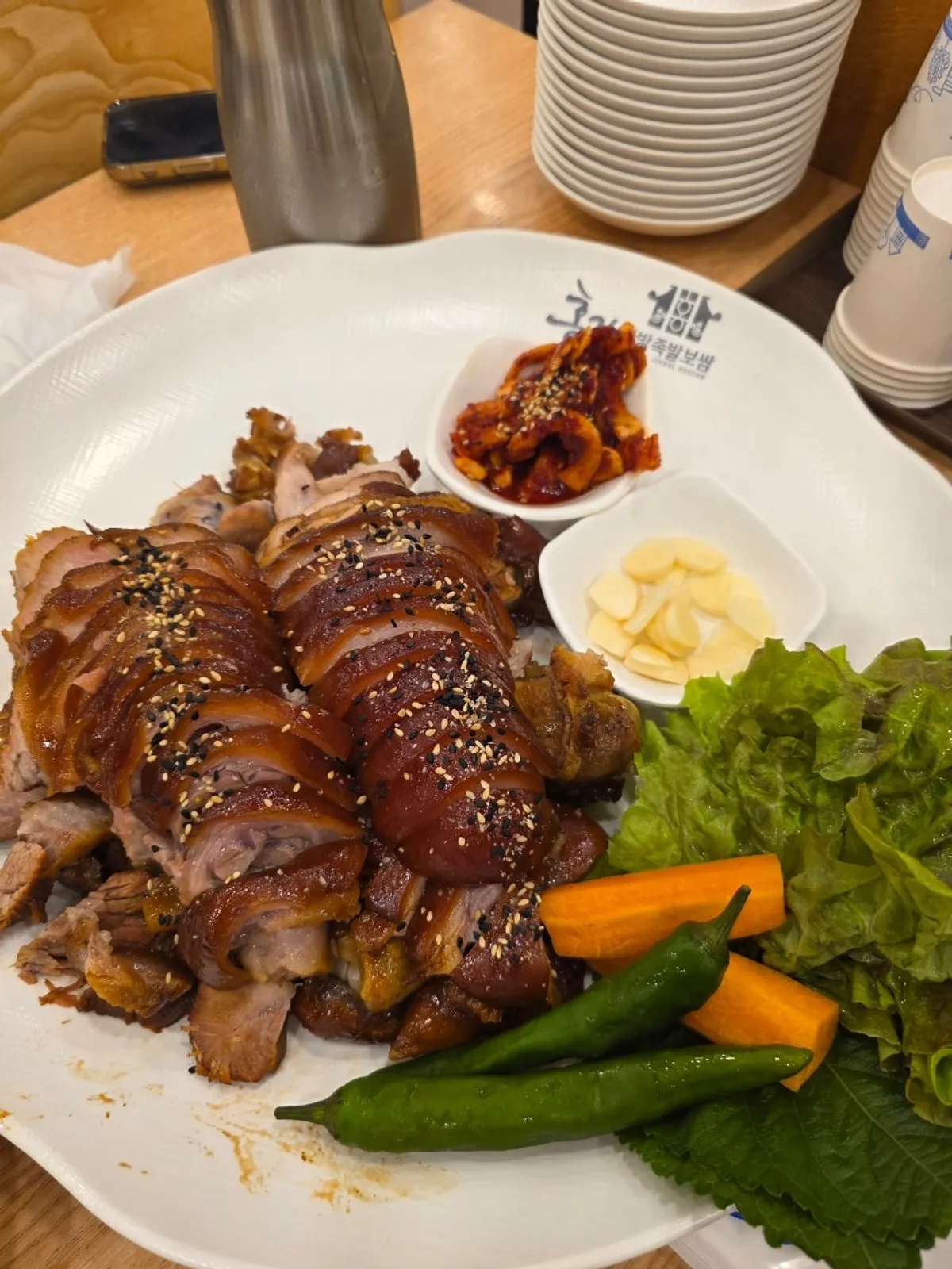 A full spread of extra-large front trotter jokbal and platter makguksu