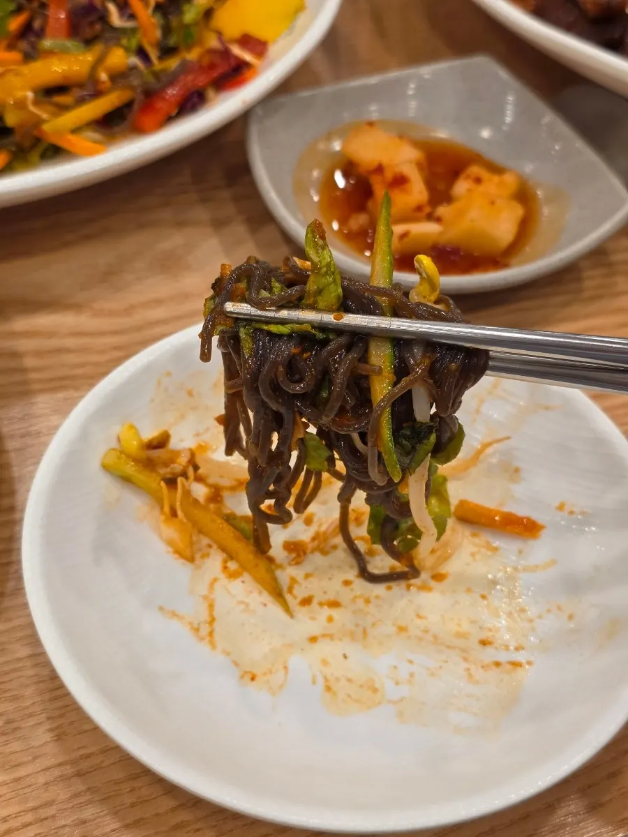 Tangy, spicy platter makguksu with a slushy ice sauce