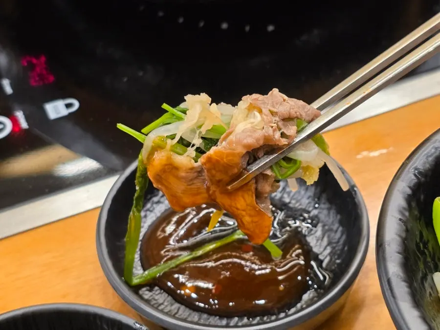Soy sauce dip and chili sauce at the self-serve bar