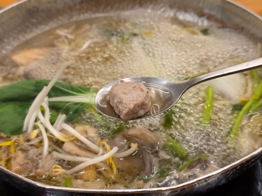Meatballs added into the broth