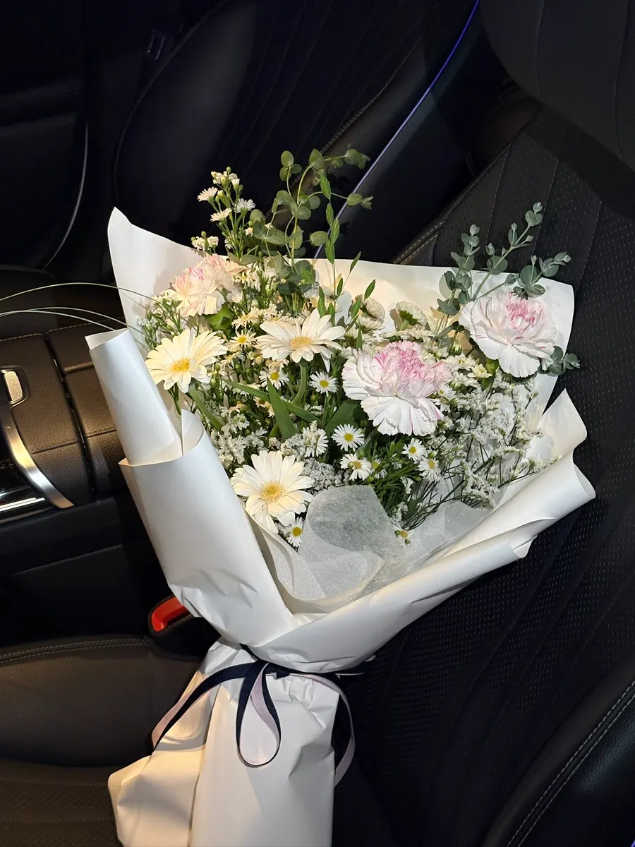 Close-up of the bouquet checking petal and leaf condition
