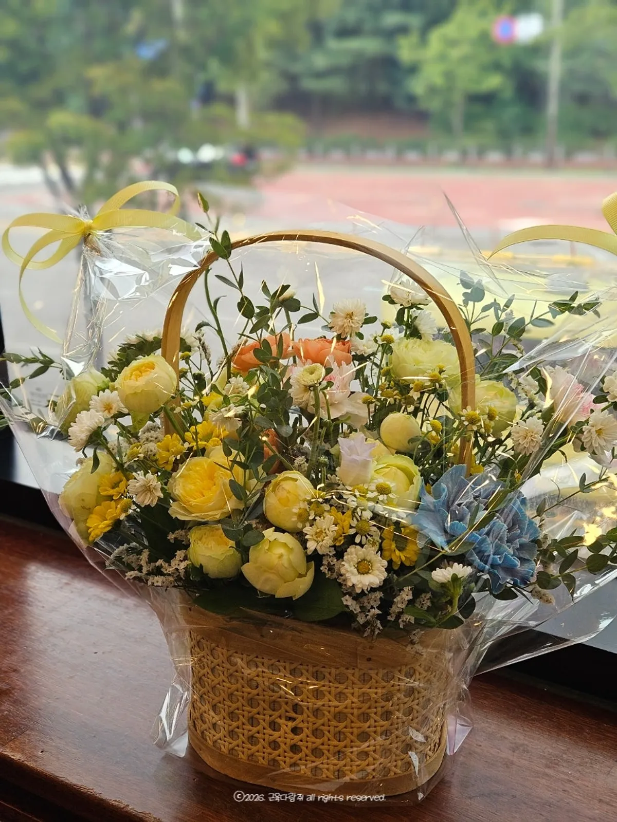 Bright birthday flower basket that looks like a moved flower field