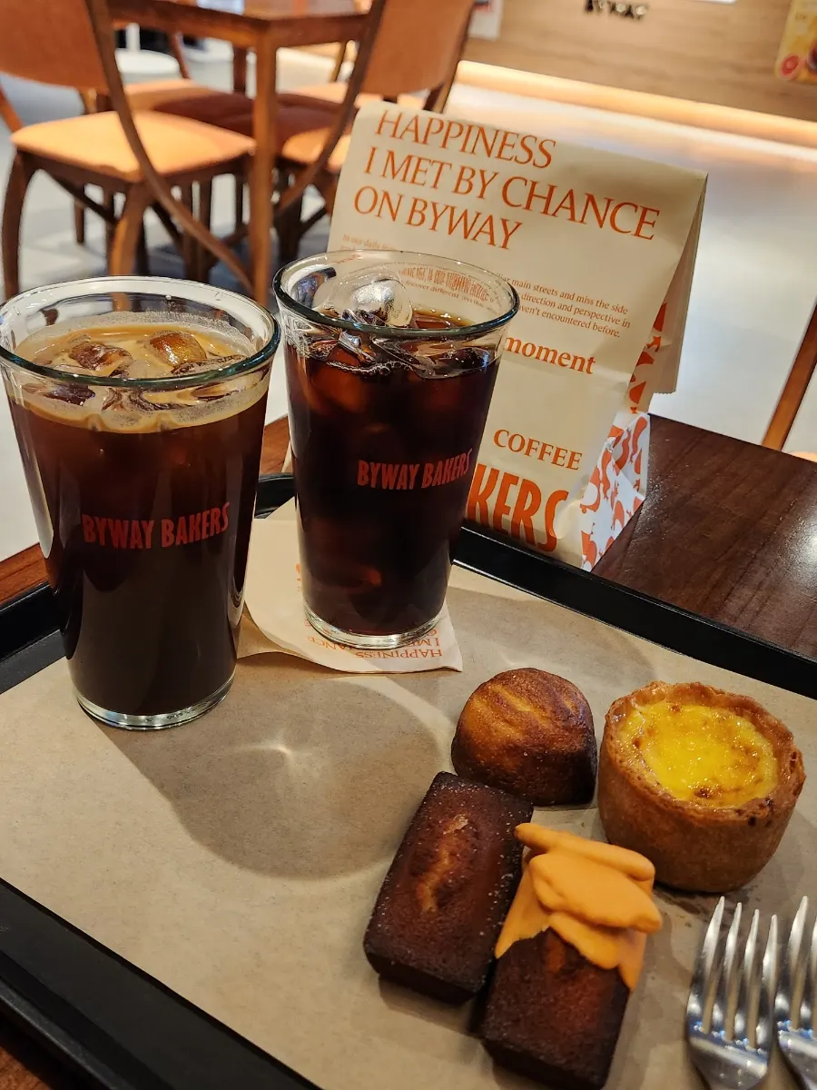 Two cups: americano and decaf cold brew