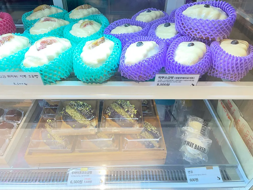 Display case with salt bread and other bakery items