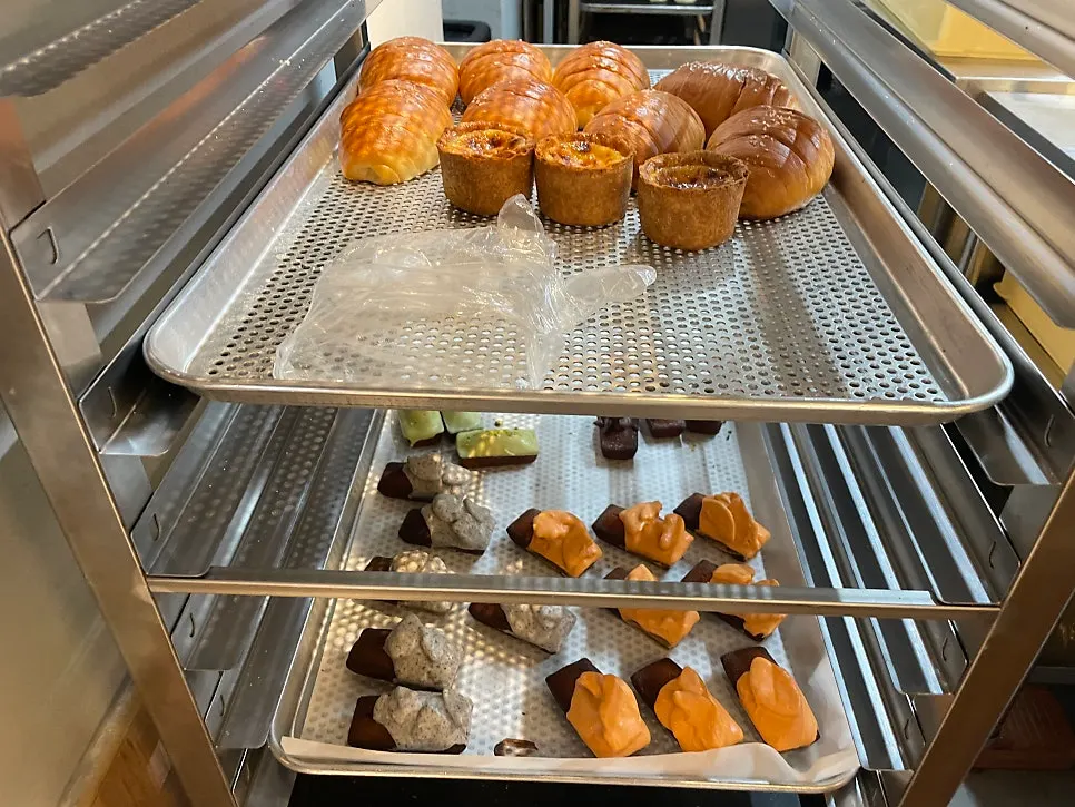 Hong Kong pineapple buns and butter rice cakes on display