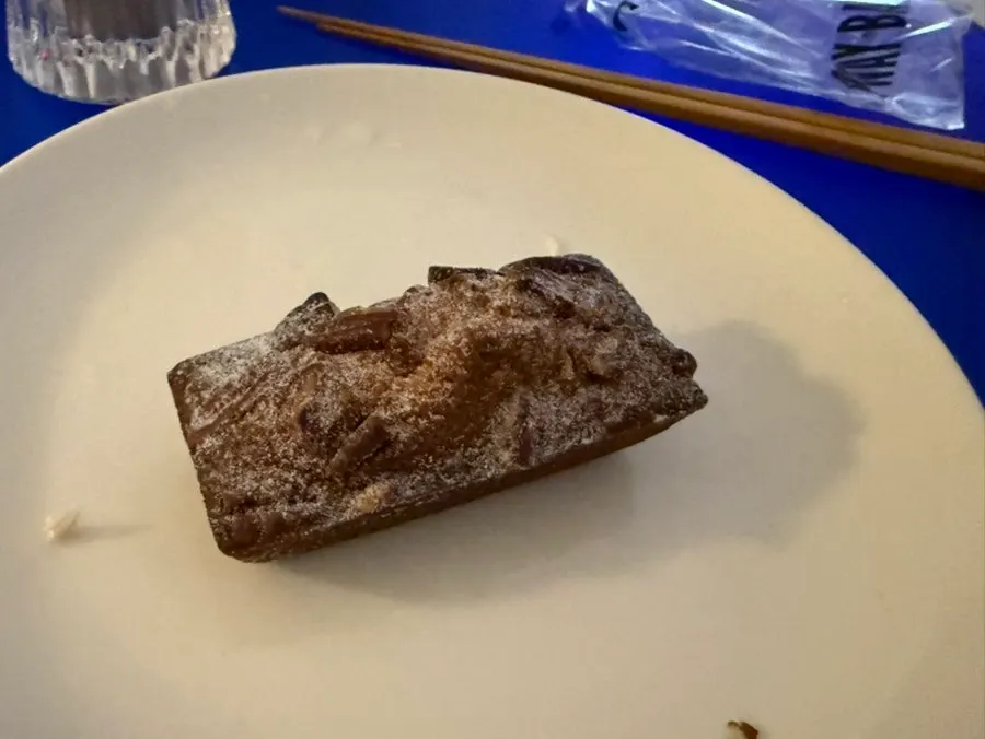A bite taken out of the almond chocolate financier