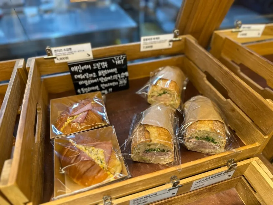 Egg tarts and salt bread on display