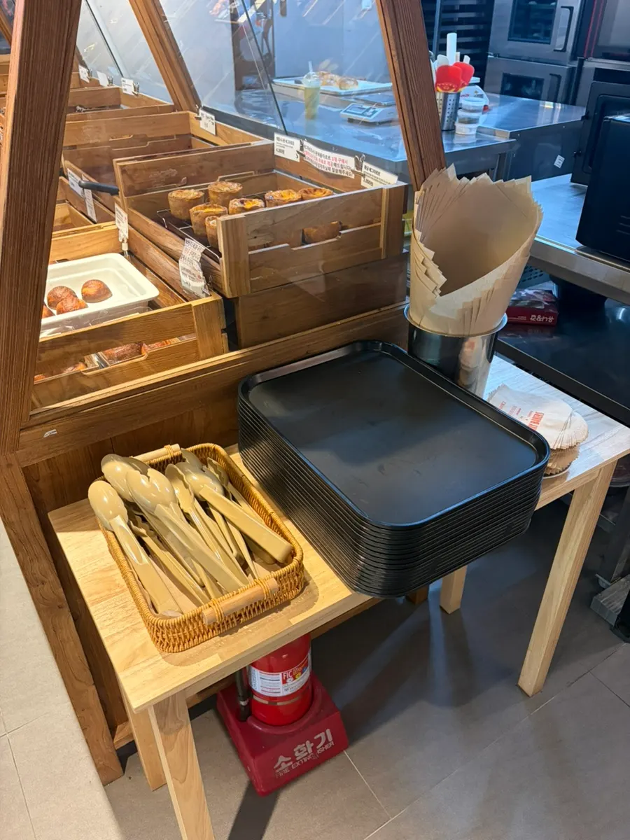 Bakery display case with a spot to grab a tray