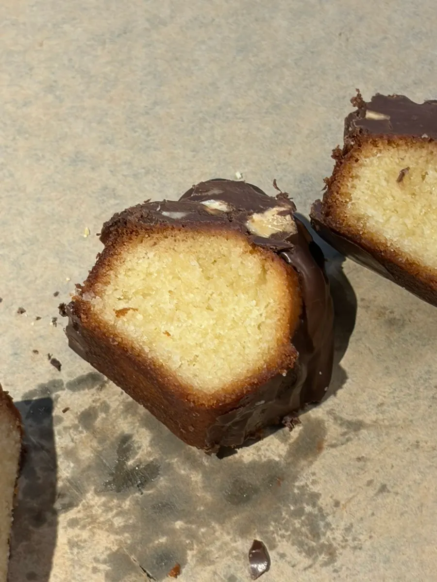 A piece of the almond choco financier cut with a fork