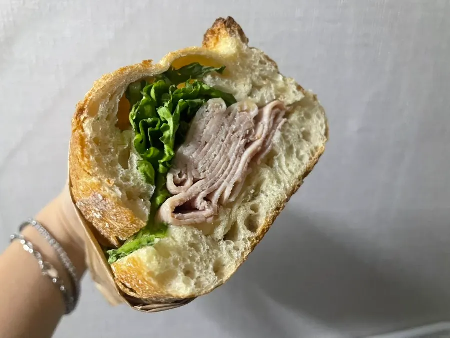 Cross-section of the baguette with ham and butter
