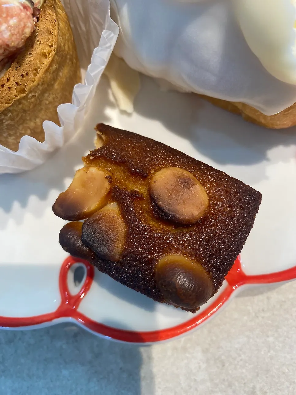 Close-up of financier topped with macadamia