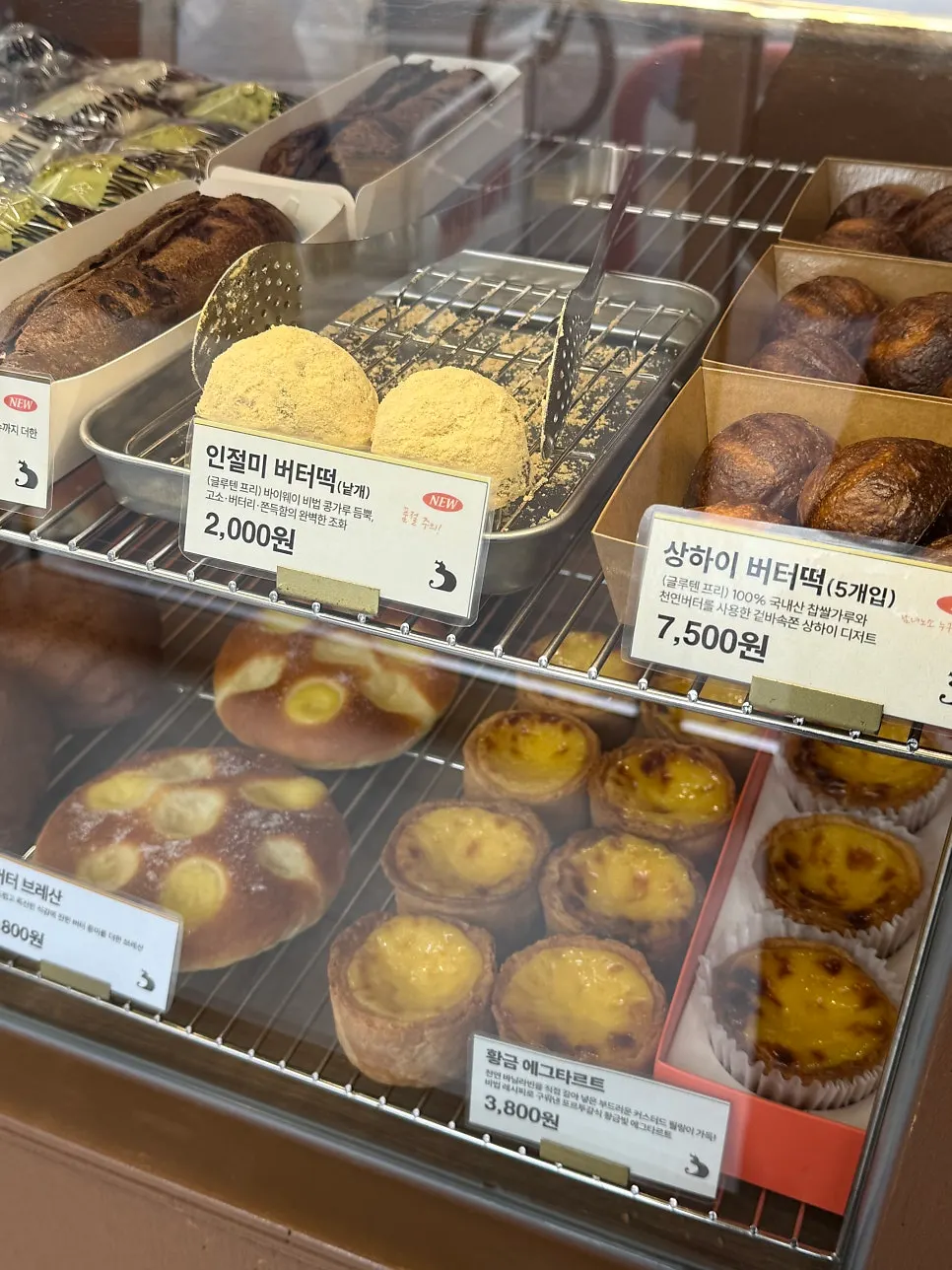 Display case with baked snacks and bread