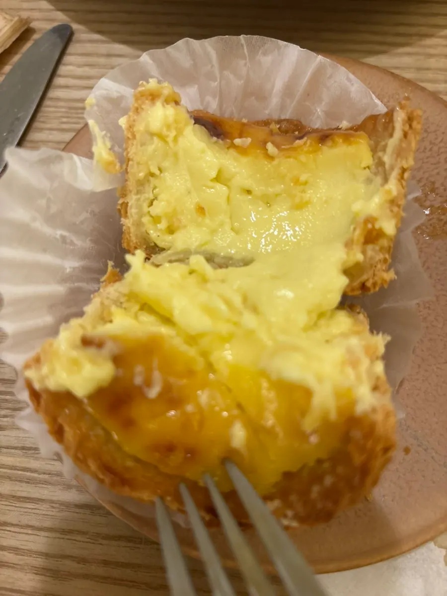 Egg tart with birthday candles stuck in it