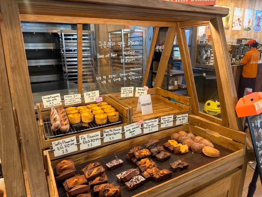 Display of red bean bread, bagels and croissants