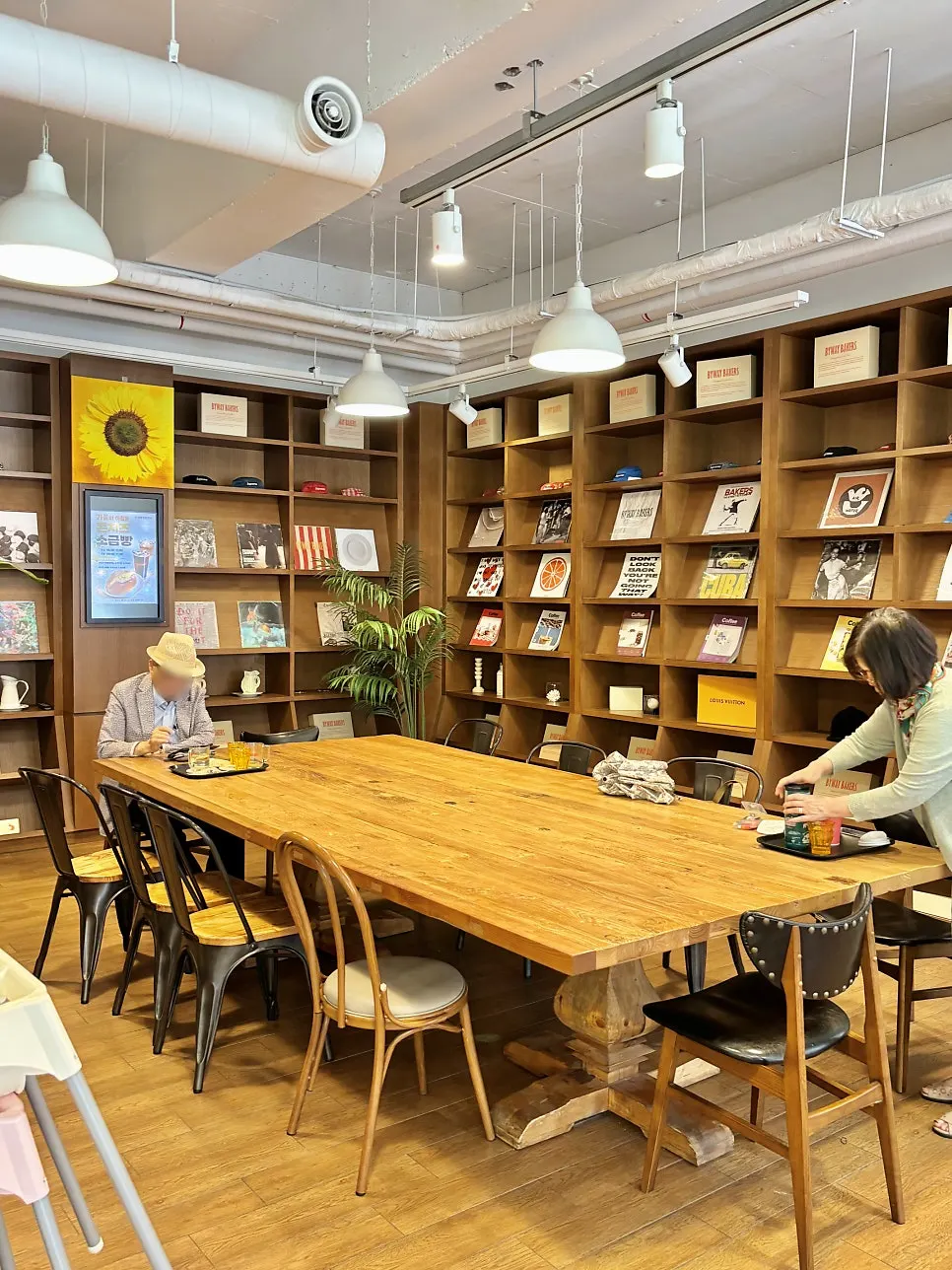 Bakery café interior with laptop and meeting customers