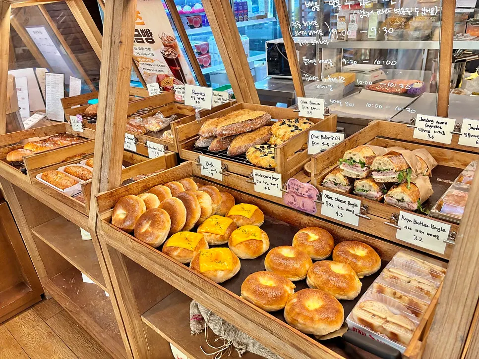 Bakery lineup including egg tarts and baguettes