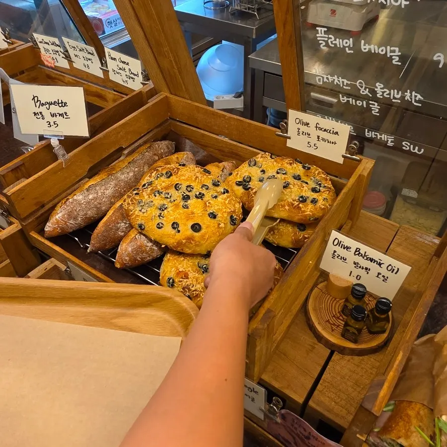A variety of bread on the bakery display shelf