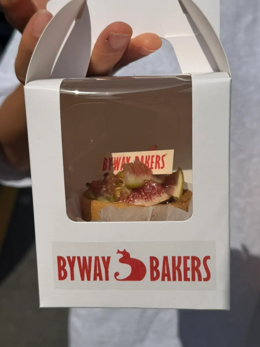 Bag of sandwiches and tart being carried home