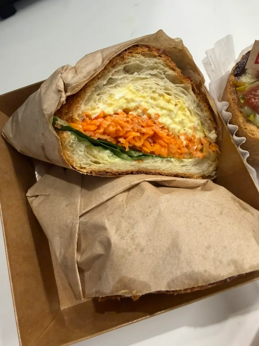 Carrot rapé egg sandwich and chicken breast sandwich laid out