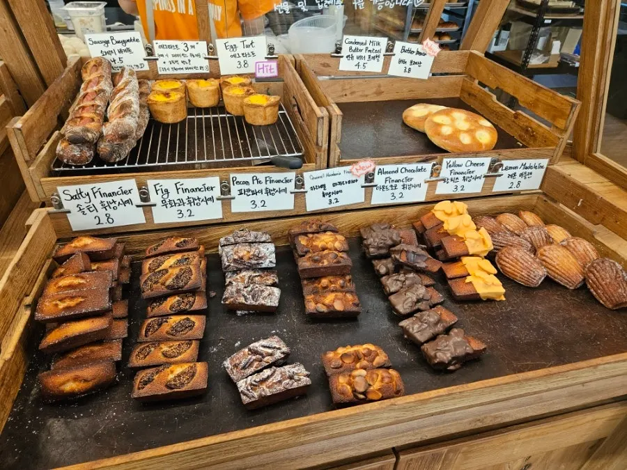 Garlic baguette and pineapple buns on display