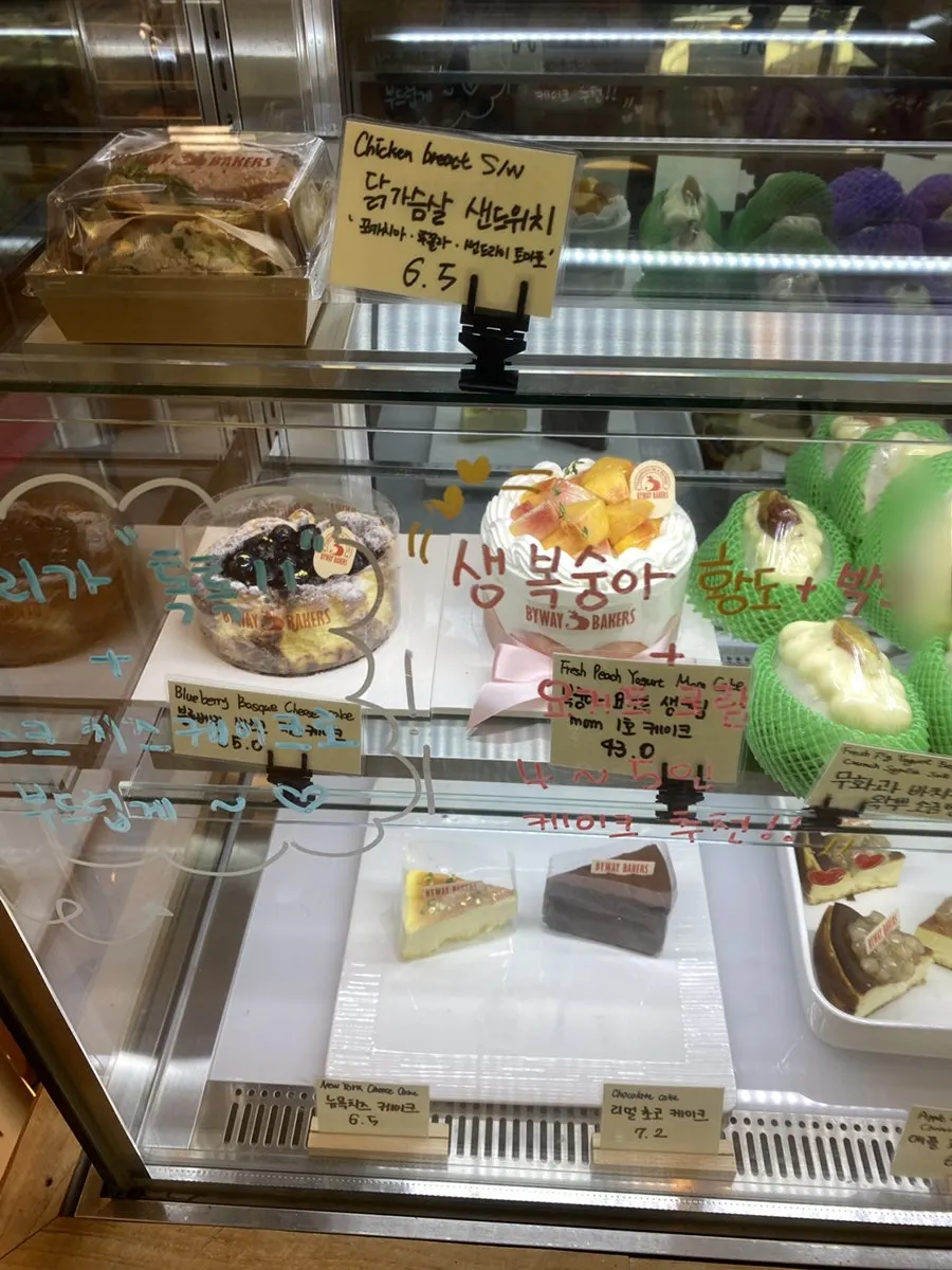Shelf with egg tarts and financiers
