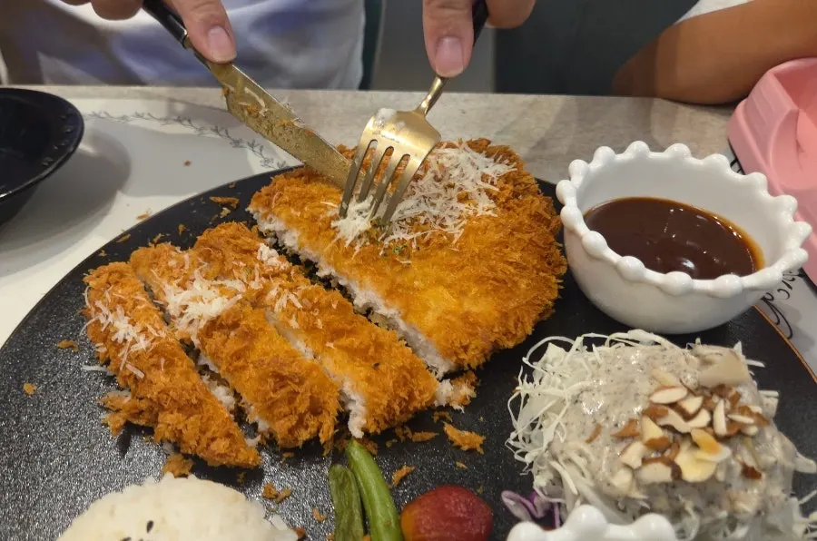 Thickly sliced Hanpork sirloin pork cutlet on a plate