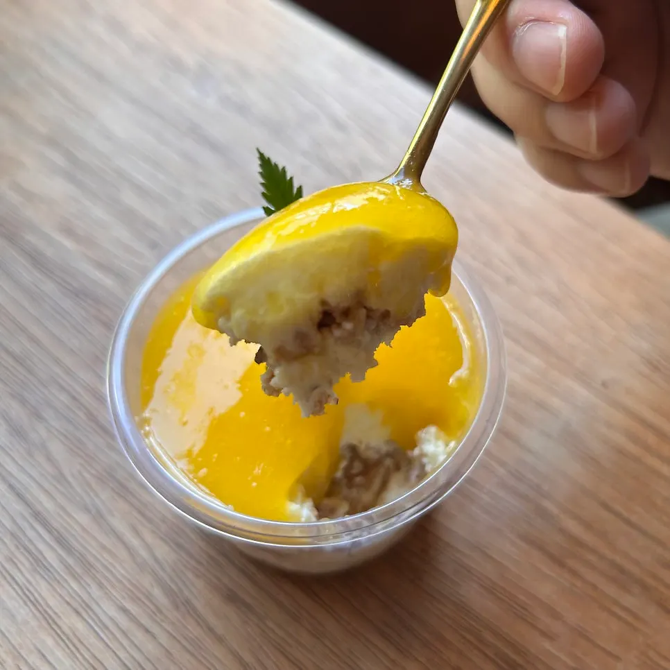 Close-up of a bite of apple mango cheesecake