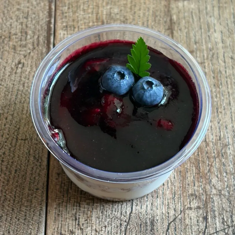 Berry-berry cheesecake topped with berry sauce