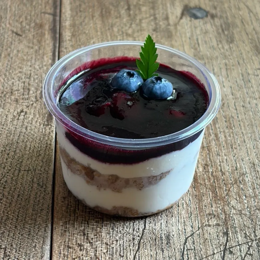 Cross-section of the berry-berry cheesecake showing the soft cheese filling