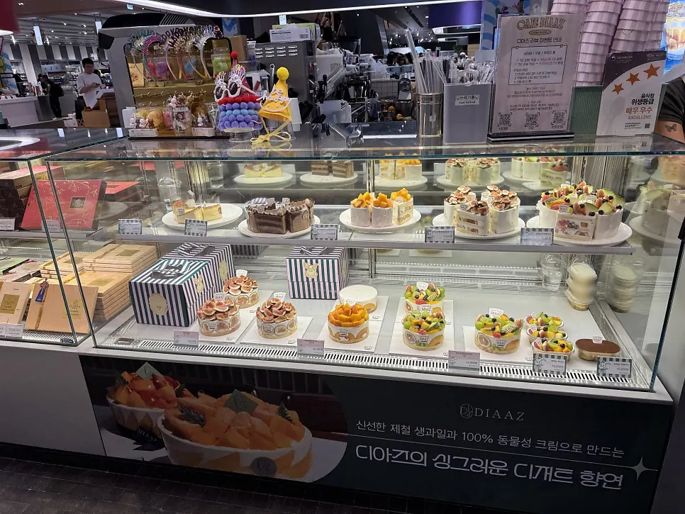 Showcase filled with seasonal fresh-fruit cream cakes