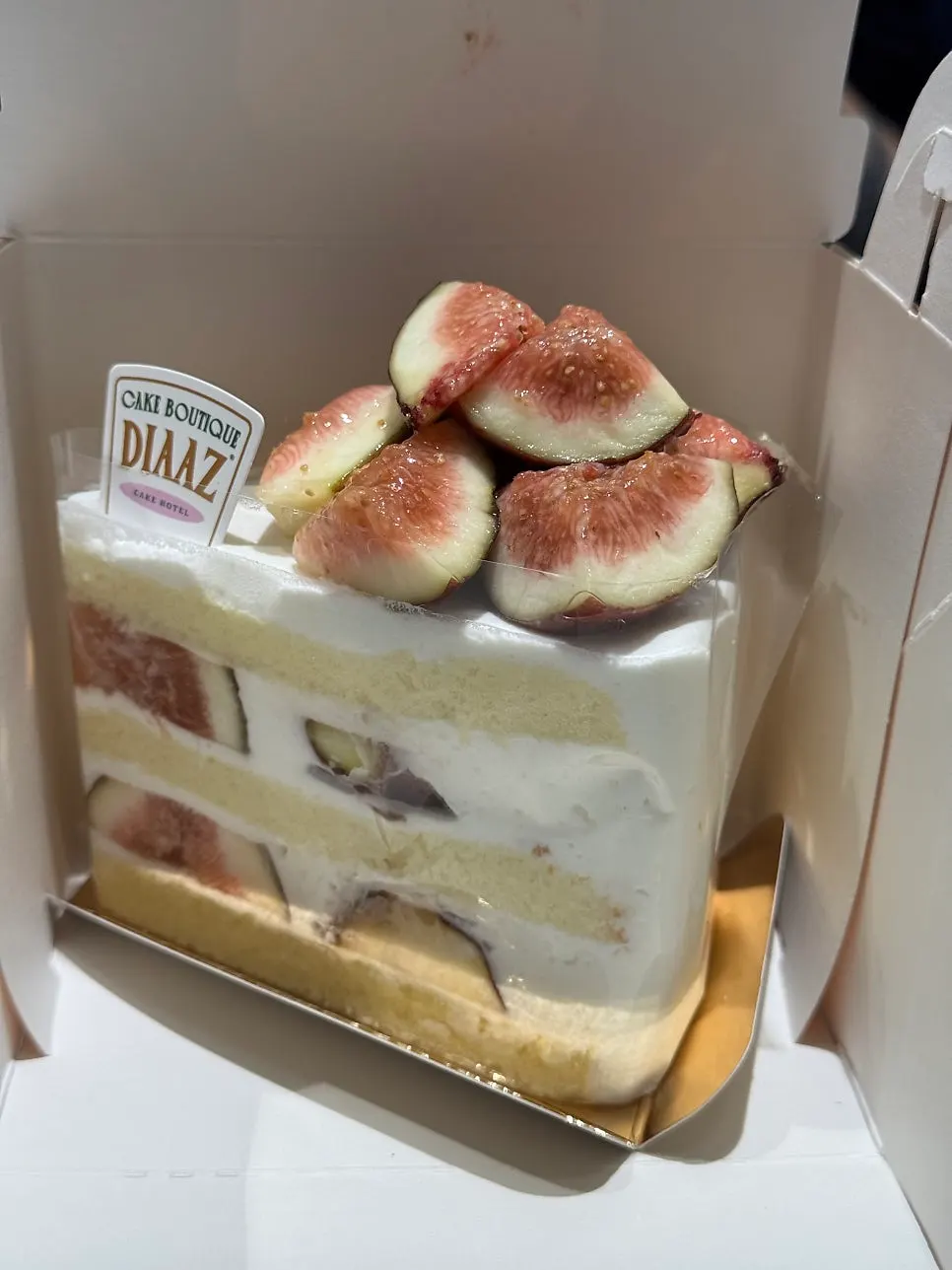 Cross-section of the cream cake layered with honey figs