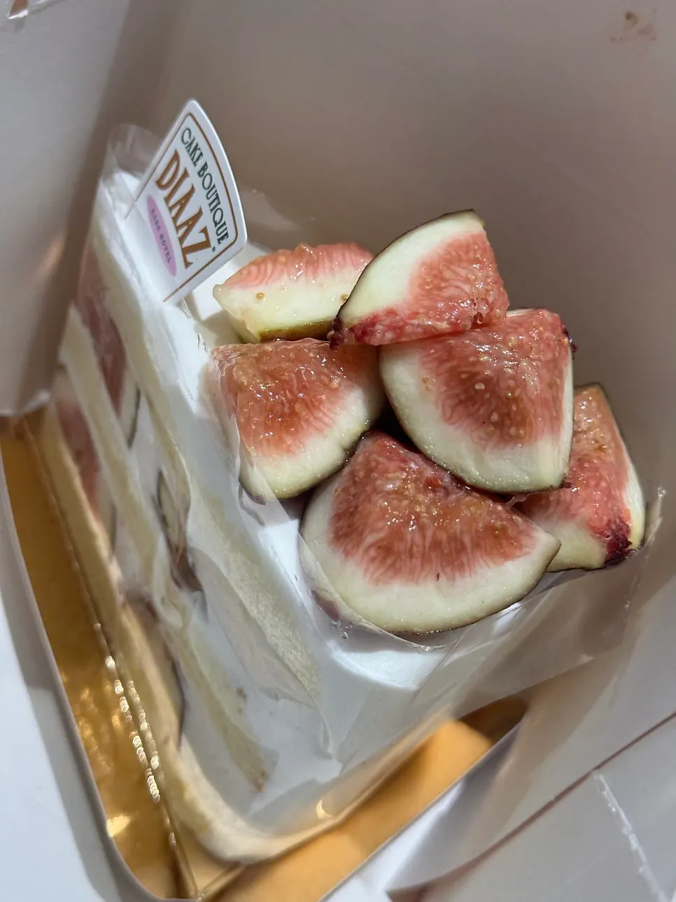 Slice cake secured neatly inside the takeout box