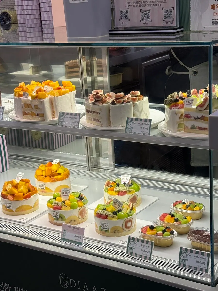 Display case with plum and fig cream cakes