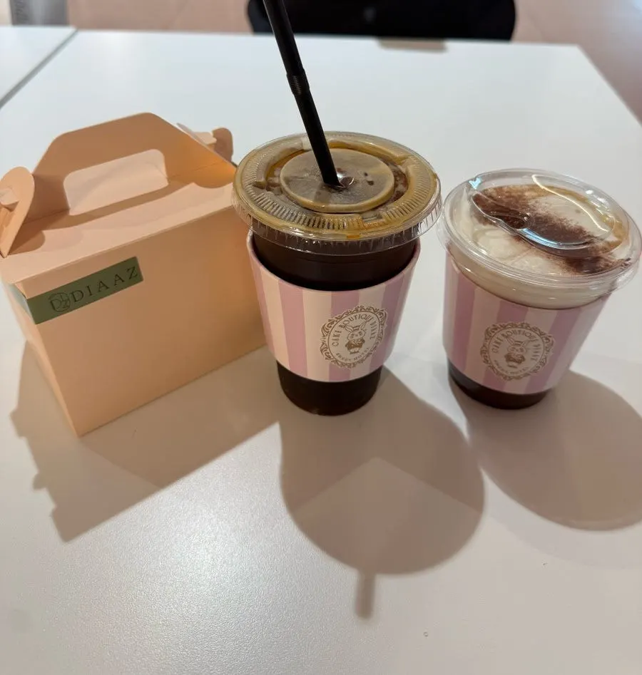 A cup of coffee ordered alongside the cake