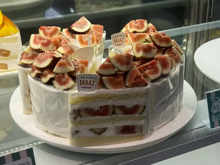 Café Diaz slice cake topped with fresh fruit