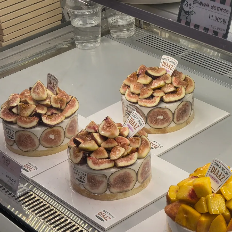 Slices of fig whipped cream cake on display