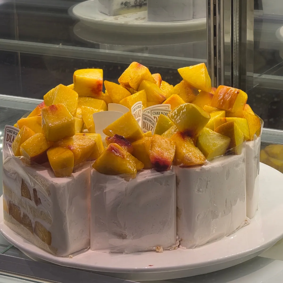 Café Diaz's peach fresh fruit cake piled with peaches