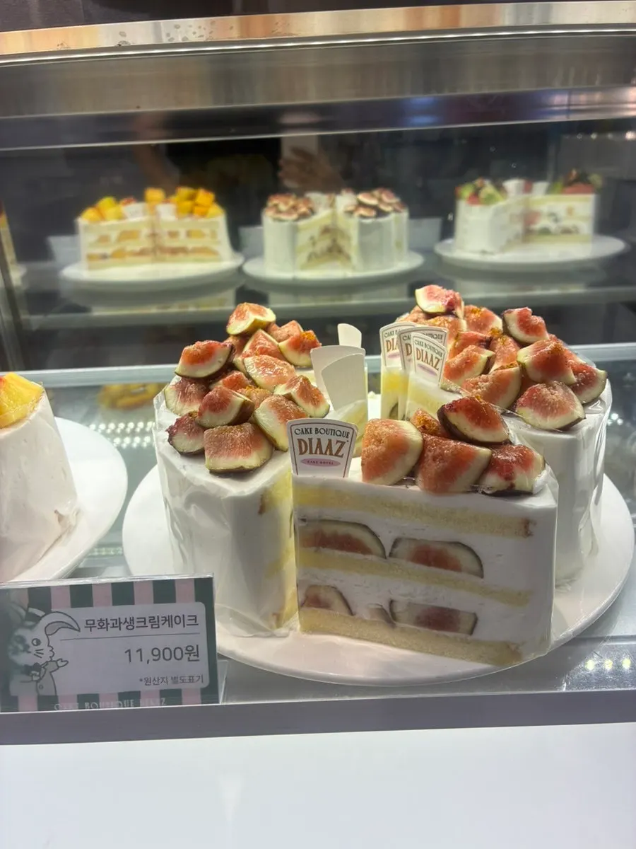 Fresh cream cake slice from Café Diaz piled with fruit