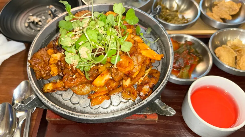 Grilled spicy pork cooking on a personal grill