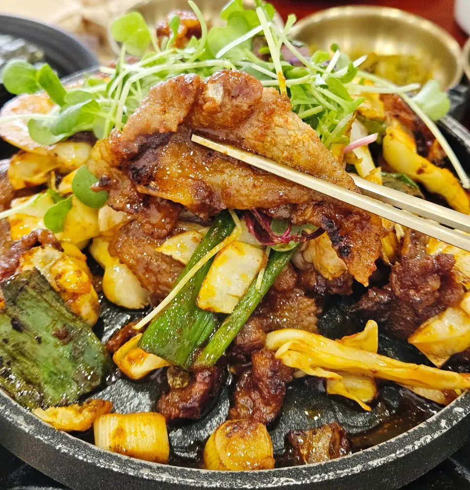 Close-up of smoky fire-grilled pork stir-fry