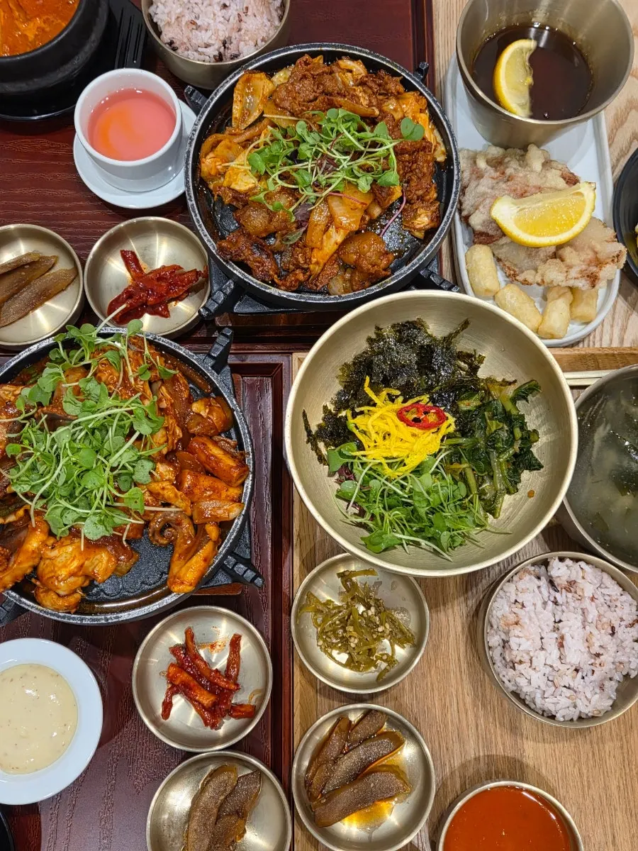 Three solo Korean set trays laid out on the table