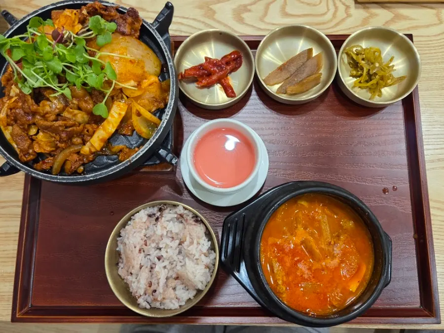 Full Korean set tray with side dishes and stew