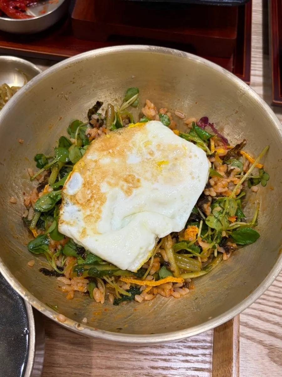 Summer yeolmu bibimbap served in a brass bowl