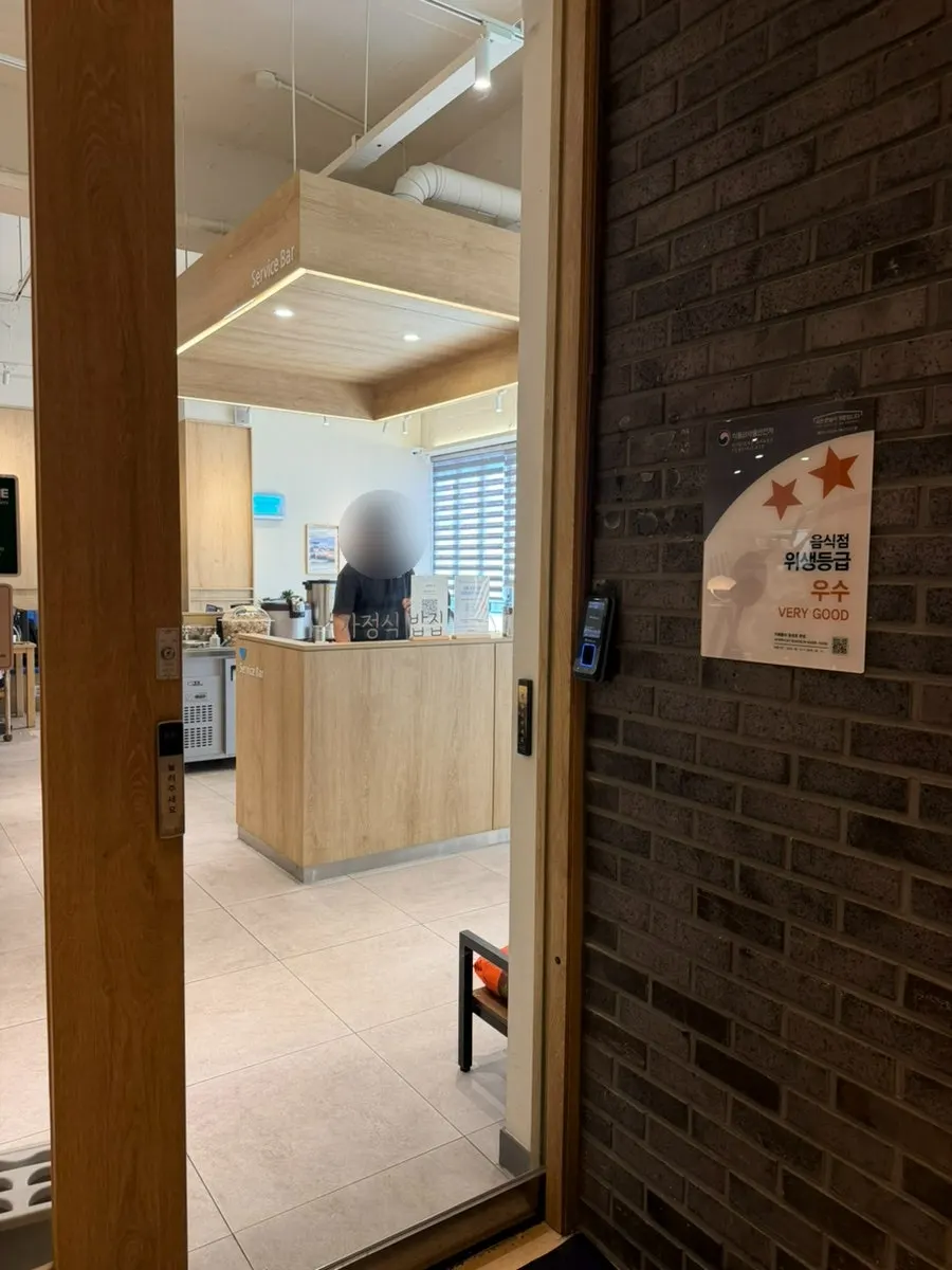 Sign for the Cafe Dongi entrance on the 2nd floor