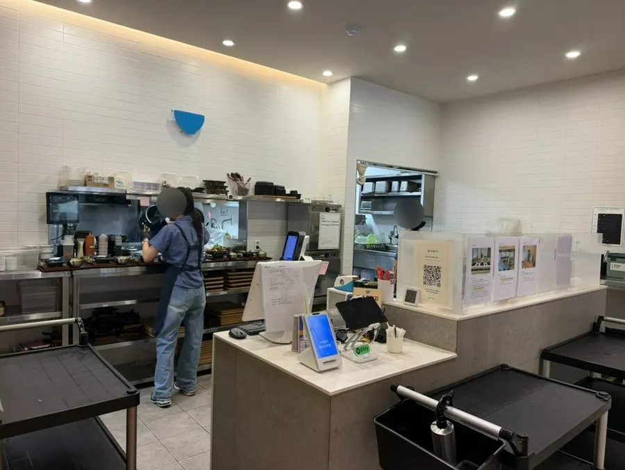 Staff preparing food at the Cafe Dongi counter